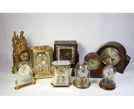 A walnut veneered Westminster chime mantle clock together with a collection of oak &amp; mahogany cased mantle clocks and wal