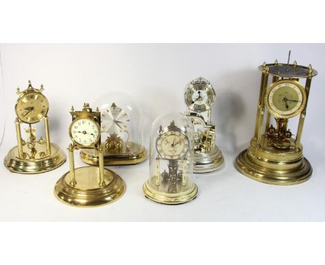 A collection of manual &amp; quartz anniversary clocks, together with mid 20th Century alarm clocks, wall barometers and mant