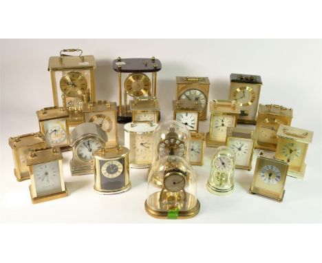A collection of mantle and wall clocks to include a Prescot 31 day wall clock, a USA 8 day striking mantle clock, and a selec