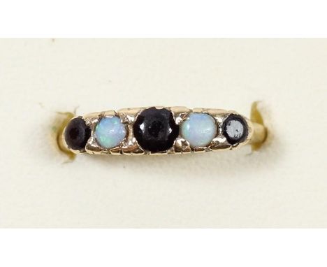 A 9ct gold garnet and opal ring, N 1/2, 2.2gm 