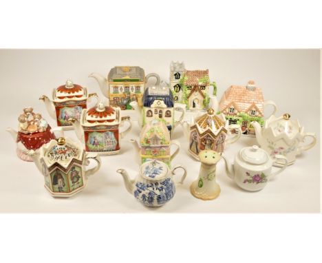 A large collection of ceramic novelty and other teapots in four boxes. (4) 