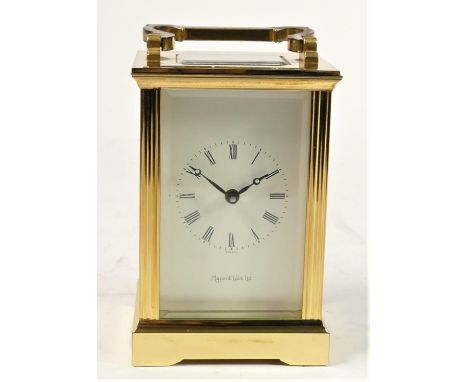 A Mappin &amp; Webb manual wind carriage clock, brass case with bevelled edge glass panels, white enamelled dial &amp; Roman 