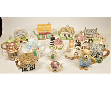 A large collection of ceramic novelty teapots in four boxes. (4) 