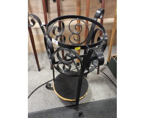 A BENT IRON STICK STAND - H 66 CM 