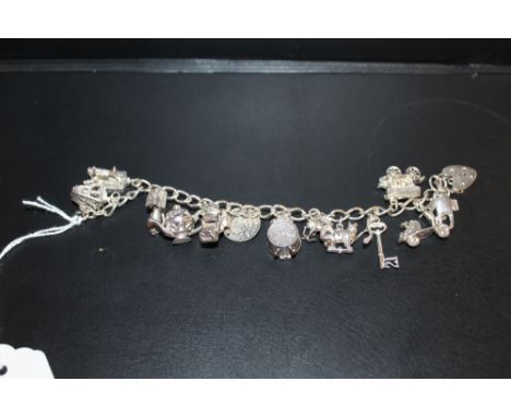 A VINTAGE SILVER CHARM BRACELET 