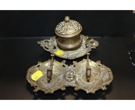 A VINTAGE BRASS INKWELL AND QUILL STAND 