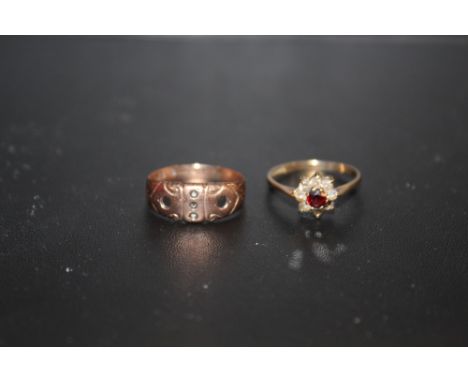 A HALLMARKED 9 CARAT GOLD AND GARNET DRESS RING, TOGETHER WITH A 9 CARAT ROSE GOLD EXAMPLE - MISSING STONES COMBINED APPROX W