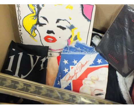A BOX OF MARILYN MONROE TEXTILES TO INCLUDE TEA TOWELS, ANN SUMMERS STOCKINGS ETC. 
