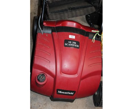 A MOUNTFIELD SE350 SCARIFIER TOGETHER WITH AN ELECTRIC STRIMMER, SMALL SELECTION OF GARDEN TOOLS ETC