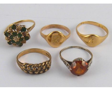 A mixed lot comprising two 9 carat gold rings (5.9 gms), one set with diamonds, a white metal (tests 9 carat gold) stone set 