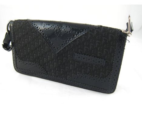 Christian Dior. A vintage lady's handbag by Christian Dior Paris, approx 26 cm long, with original protective cover.
