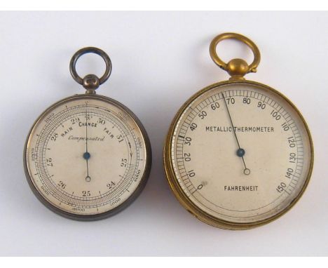 An aneroid barometer and a gilt metal thermometer, both with suspension loops. 