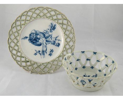 Worcester. A late 18th/early 19th. century ceramic plate with broad pierced lattice rim in green and puce, the centre a flora