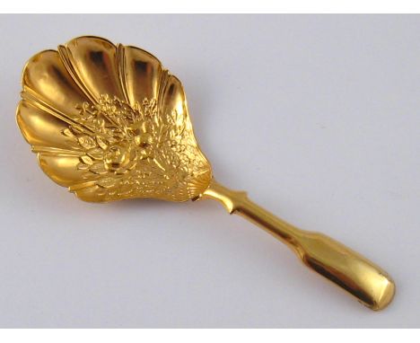 A Georgian silver gilt caddy shell caddy spoon, Joseph Taylor, Birminham circa 1815(marks rubbed).