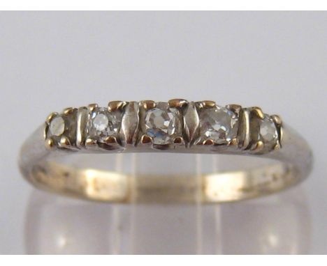 A white metal (tests 18ct gold) five stone diamond ring,  estimated total diamond content approx. 0.3ct, size T, 2.8gms.