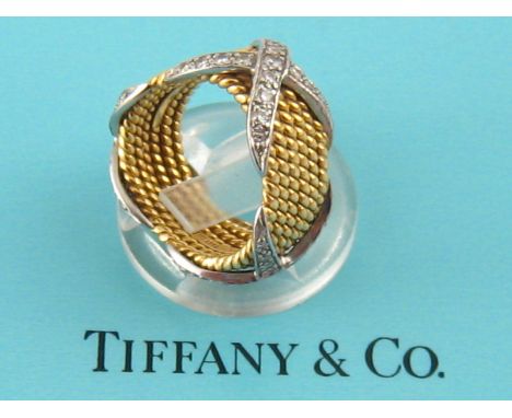 Tiffany & Co. A six row 18 carat gold twisted rope, platinum and diamond ring, designed by Jean Schlumberger for Tiffany & Co