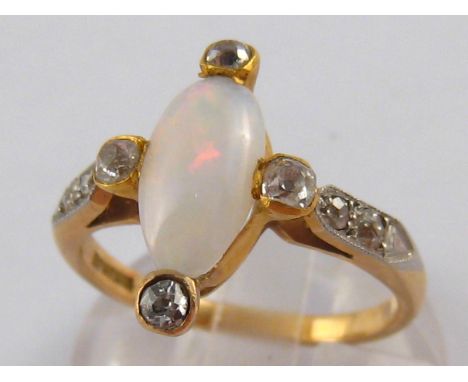 An 18 carat gold opal and old brilliant cut diamond ring, circa 1920, opal approx 11 x 6mm, ring size P ½, 4.4 gms.
