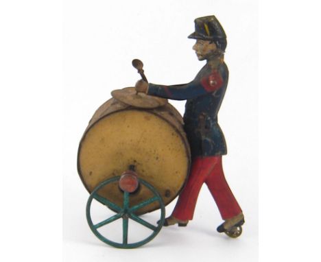 A vintage tinplate inertia drive marching soldier playing a drum and cymbals, action AF. 