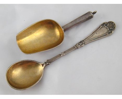 A Russian silver caddy spoon of plain conventional form, with suspensory loop to handle and gilt bowl. Marks of Ivan Khlebnik