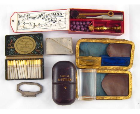 A mixed lot. A travelling glass in fitted leather case with White Star emblem, a box of miniature Turkish cigarettes, a seali