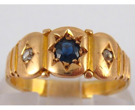 A yellow metal (tests 18 carat gold) sapphire and diamond ring, size K, 2.8 gms.