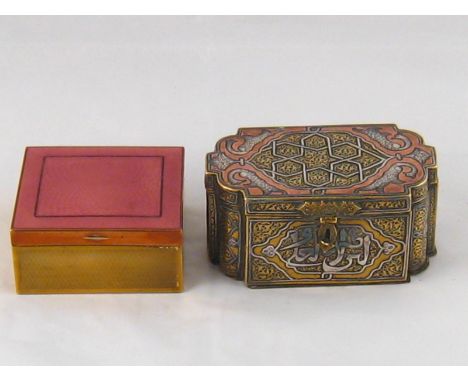 A brass Islamic casket with recessed curve corners and hasp latch, embossed and with applique copper and white metal decorati