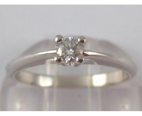 A white metal (tests 18 carat gold) diamond solitaire ring, size K, 2.3 gms.
