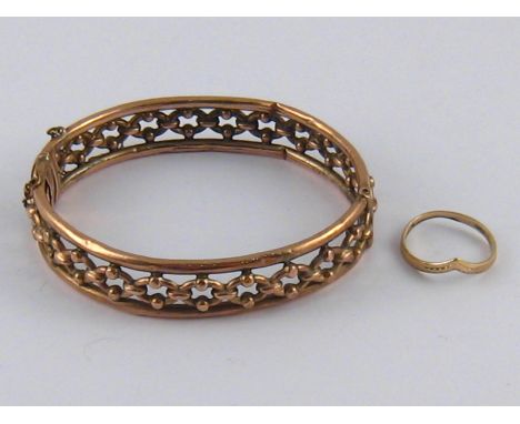 A mixed lot comprising a 9 carat gold bangle and a 9 carat gold ring, gross weight 13.5 gms.
