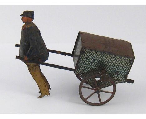 A vintage inertia drive tinplate man pulling a handcart, action AF. 