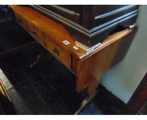A sofa table with three drawers
