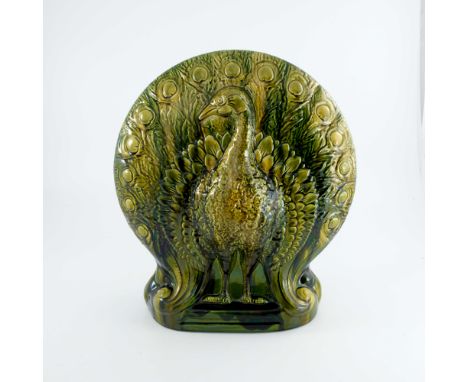 Christopher Dresser for Ault, a large art pottery Peacock flower holder, circa 1896, modelled in relief as the bird to each s