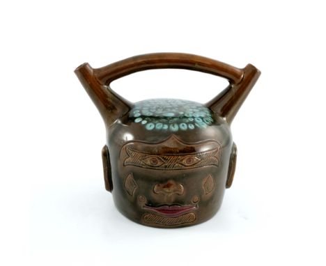 Christopher Dresser for Linthorpe, an art pottery Peruvian vessel, circa 1880, modelled after a pre Columbian face jug, doubl