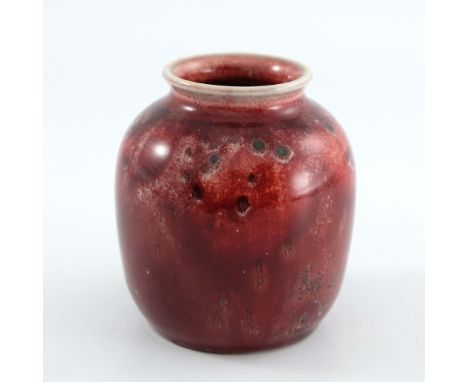 Ruskin Pottery, a small High Fired vase, 1933, ovoid shouldered form, ox blood over cream with green spots, impressed marks, 