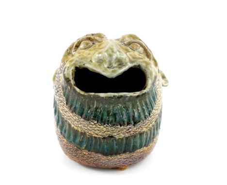 Robert Wallace Martin for Martin Brothers, a stoneware sculptural spoon warmer, circa 1882, modelled as a grotesque head, bea