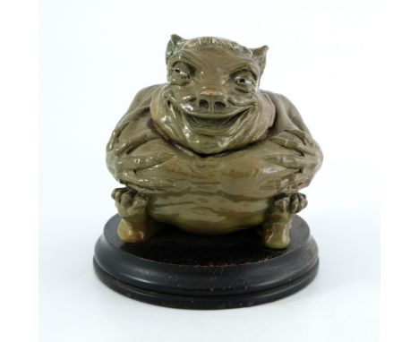Robert Wallace Martin for Martin Brothers, a stoneware sculptural monk jar, 1900, grotesquely modelled as a seated  figure wi