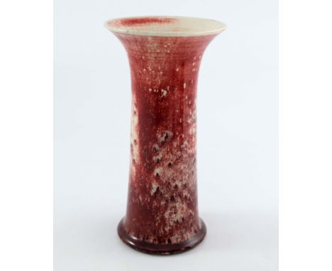 Ruskin Pottery, High Fired Lily vase, circa 1920, flared cylindrical form, ox blood flambe glaze over cream with spots, impre