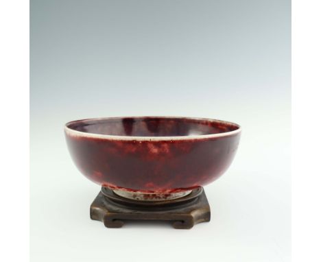 Ruskin Pottery, a High Fired bowl, 1926, rounded and footed, the exterior with a band of ox blood glaze over cream, the inter