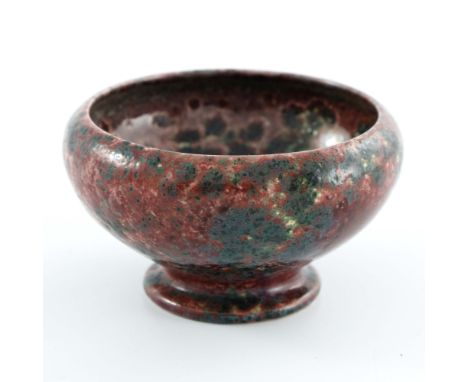 Ruskin Pottery, a small High Fired pedestal bowl or cup, 1922, rounded conical form with inverted rim, mottled and textured g