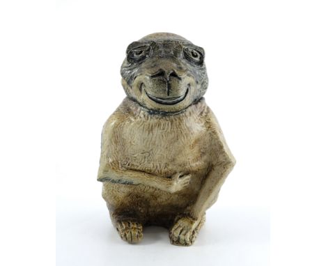 Robert Wallace Martin for Martin Brothers, a stoneware sculptural jar, circa 1882, grotesquely modelled as a characterful mon