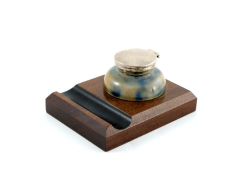 Edwin Martin for Martin Brothers, a stoneware and silver mounted inkwell, 1909, rounded with marbled blue and ochre glaze, wi