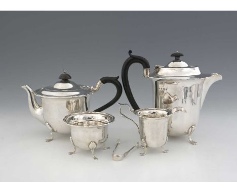 An early twentieth-century matched silver four-piece tea and coffee service, comprising coffee pot, teapot, sugar bowl with t
