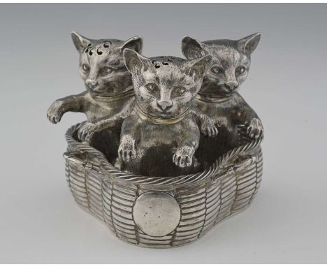 A George V silver novelty zoomorphic cruet, modelled in the form of three cats or kittens in a basket, comprising a mustard p