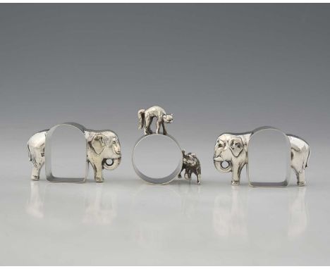 A George V silver novelty napkin ring, with cast and applied models of a cat and a dog, P Ashberry &amp; Sons, Sheffield 1922