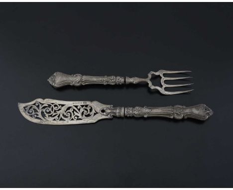 A Victorian silver fish serving knife and fork, the blade pierced with foliate scrolls, with filled handles, Hilliard &amp; T