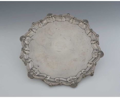 A George V silver salver, with shell and scroll border, atop four scroll feet, engraved "Waterloo Purse 1944, won by, H. Dyke