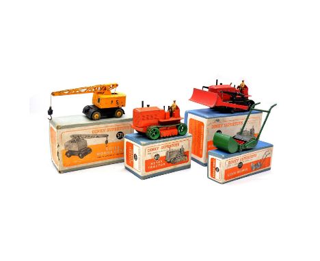 Dinky die-cast model vehicles, four including ref. 561 Blaw Knox Bulldozer; ref. 563 Heavy Tractor; ref. 571 Coles Mobile Cra