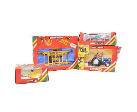 Britains farm models, four including ref. 9516 Ford Tractor and yard scrapper, ref. 9531 snow plough, ref. 9550 fold-up culti