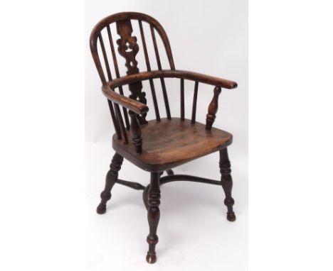 19th century yew and oak child's hoop back armchair, central pierced splat, solid seat, and raised on ring turned splayed sup