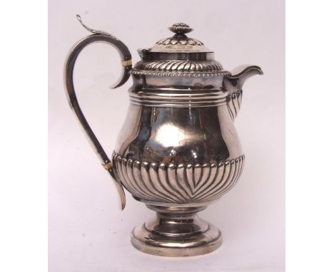 Late George III hot water pot of baluster form with hinged and domed cover and bladed finial, with flared collar and half wry