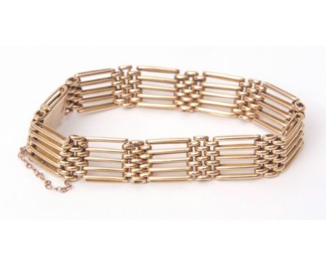 15ct stamped gate bracelet, the five bar design with mesh work links, safety chain fittings, 29gms